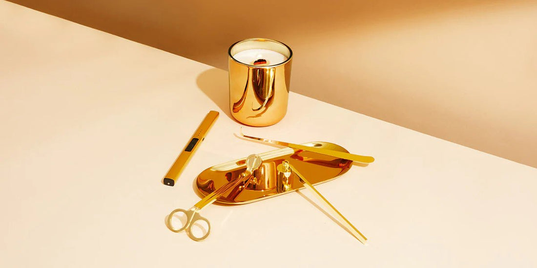 Candle with gold plated candle tools